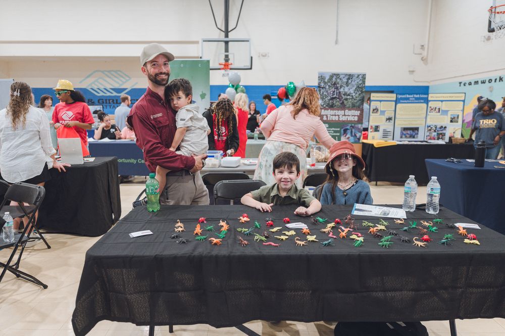 Jacob Richardson and his children at the Preferred Pest Control booth at the BNI and Boys and Girls Clubs Trades Expo in Chattanooga